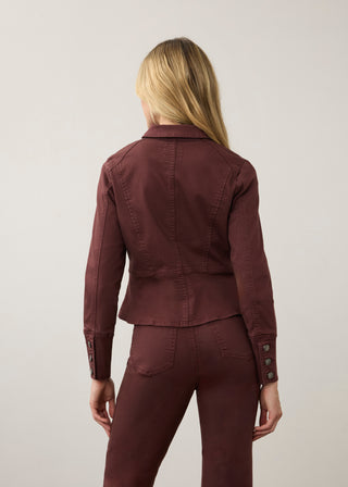 Back of a woman wearing a merlot colored jacket and similar colored pants