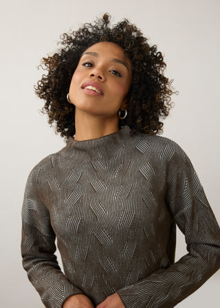 Woman in a geometric print sweater