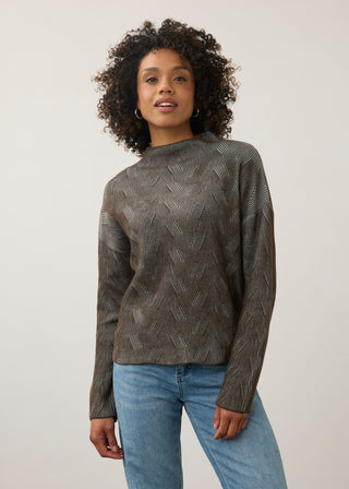Woman in a geometric print sweater