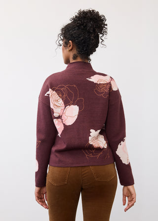 Back of a woman wearing a floral print sweater