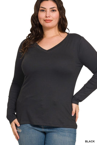 Woman wearing a black long-sleeve top on a white background