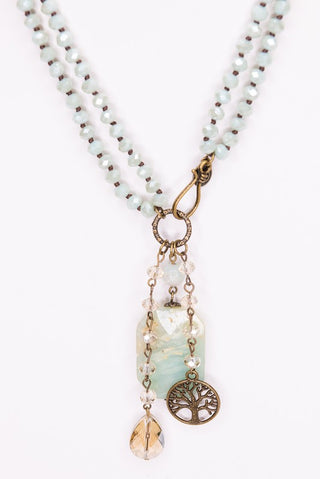 Beaded necklace with tree and crystal charm