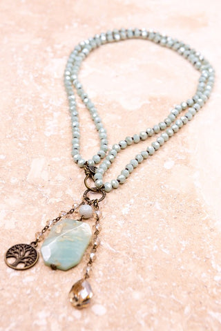 Mint colored necklace with various charms