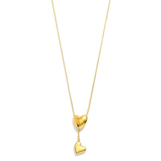 Gold heart-shaped pendant necklace on a white background