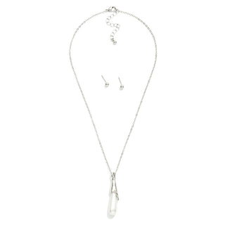 A silver-toned jewelry set featuring a delicate chain necklace with a teardrop-shaped pendant and matching stud earrings, displayed on a clean white background.