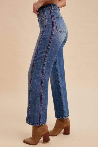 Blue jeans with red piping down the side
