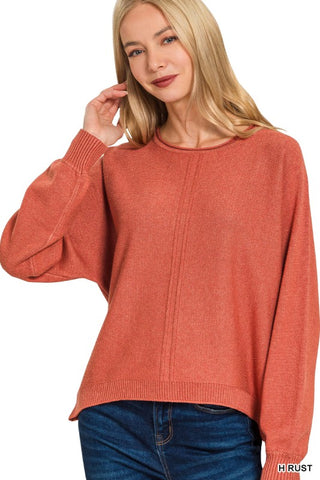 Model wearing a rust colored sweater