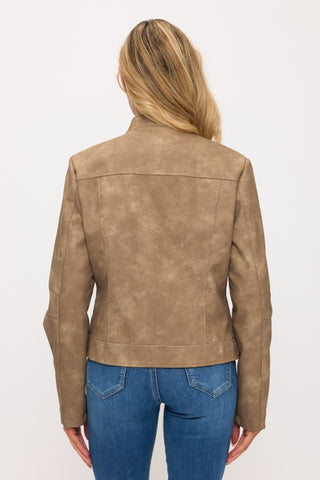 Brown leather jacket worn by a person on a white background