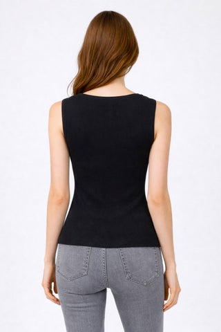 Back of a woman wearing a black tank top