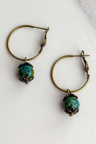 Hoop earring with a green stone bead