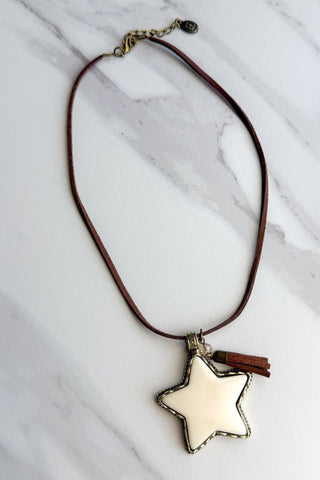 Brown necklace with white star pendant and brown tassel