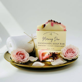 Handmade soap bar with roses on a decorative plate