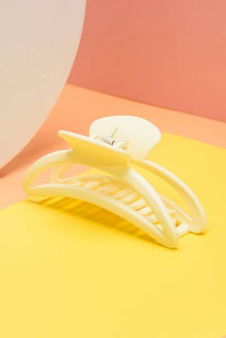 White hair clip on a colorful background