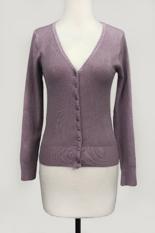 A mauve purple long-sleeve knit cardigan sweater with a V-neck and button-front closure, displayed on a white mannequin torso against a light gray background.