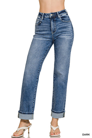 Blue jeans worn by a person on a white background