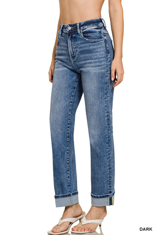 Blue jeans worn by a person on a white background