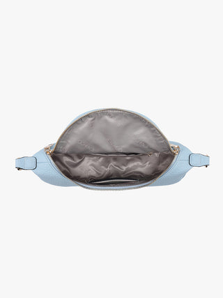 Light blue crossbody bag with open zipper on a white background