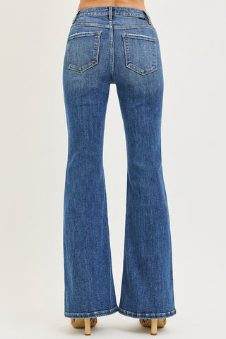 Back of woman wearing jeans and heels