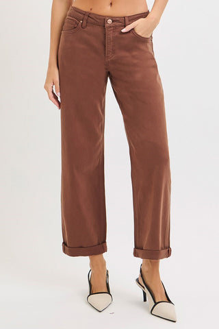 Woman wearing heels and brown pants