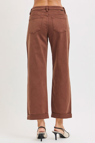 Back of woman wearing heels and brown pants