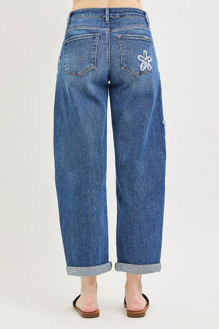 Blue jeans worn by a person on a white background