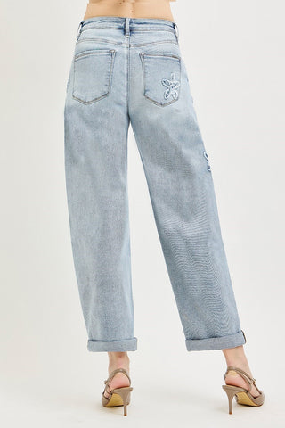 Light blue jeans worn by a person on a white background