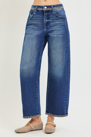Woman wearing jeans with geometric stitching