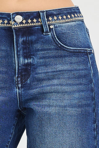 Geometric stitching details on a pair of jeans