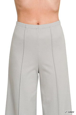 Woman wearing grey slacks