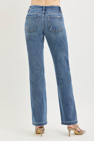 Blue jeans worn by a person on a white background