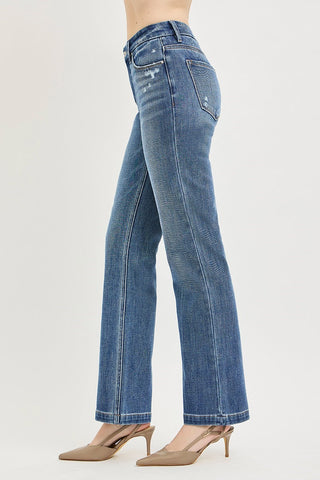 Blue jeans worn by a person on a light gray background