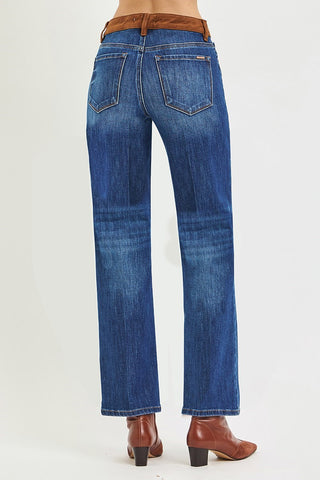 Back of woman wearing brown boots and jeans
