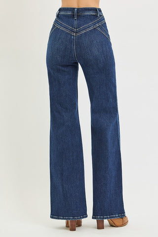 back of woman wearing jeans and brown shoes