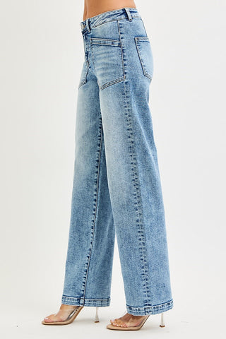 Side view of woman's legs wearing jeans