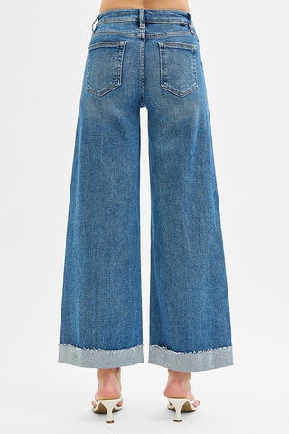 Blue wide-leg jeans on a white background