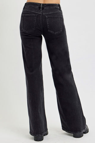 Black flared jeans on a white background