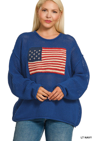 Woman wearing a blue sweater with an American flag design on a white background