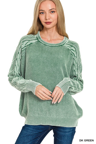Green sweater with cable knit sleeves